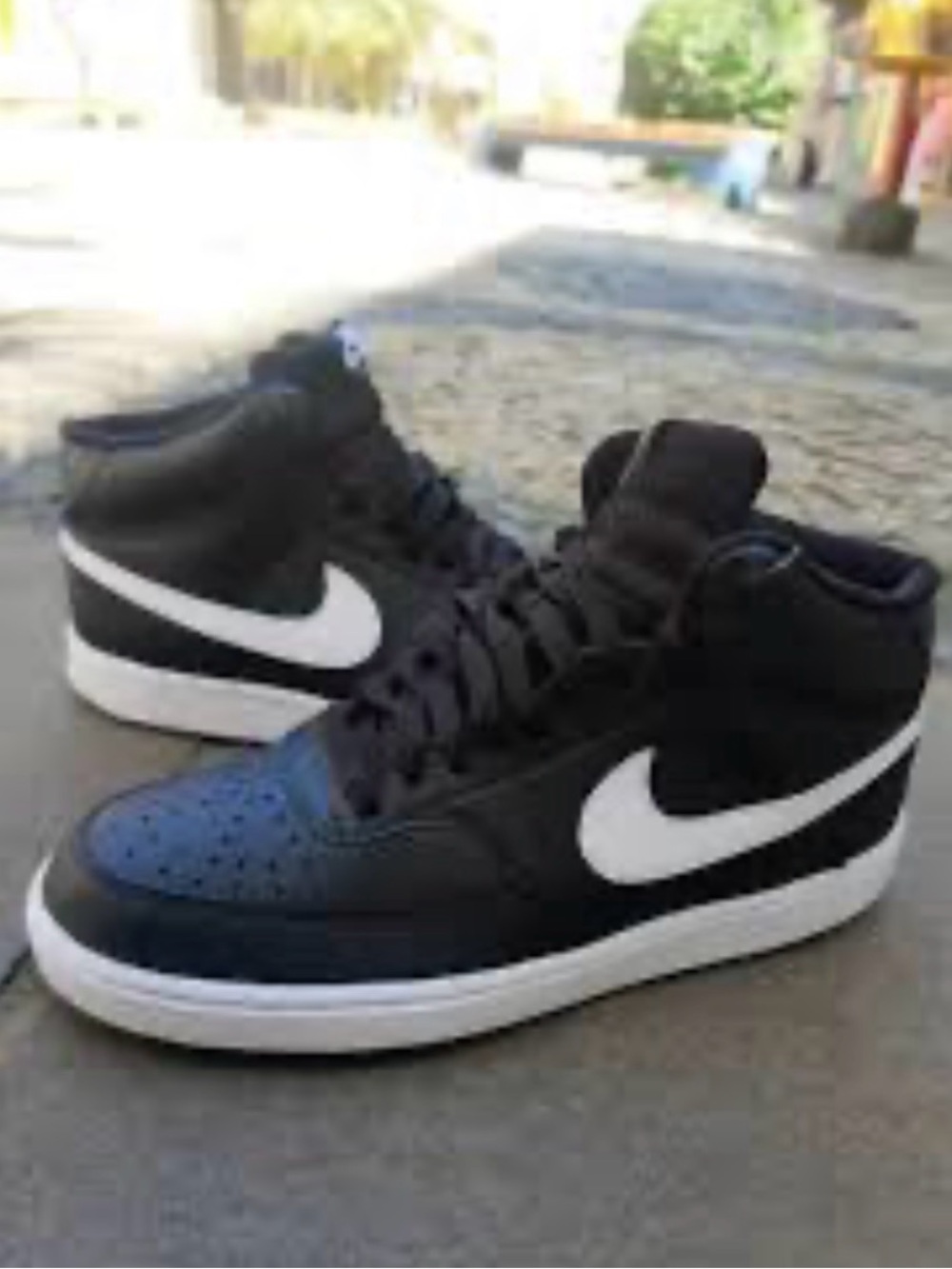 Nike Women’s Black and White High-Top Sneakers